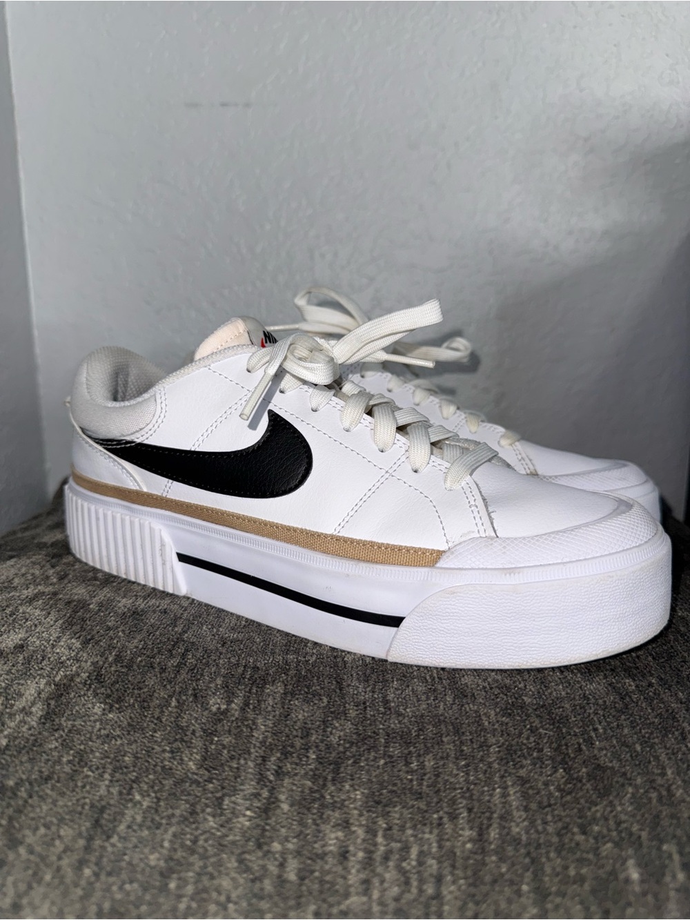 Nike Women's White Sneakers with Black Swoosh and Tan Stripe